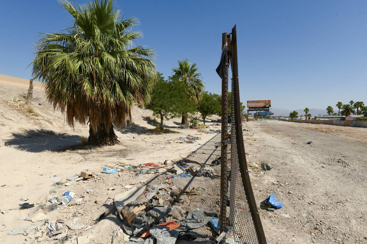A fence separates state land, left, and county land along Interstate 11 between the Boulder Hig ...