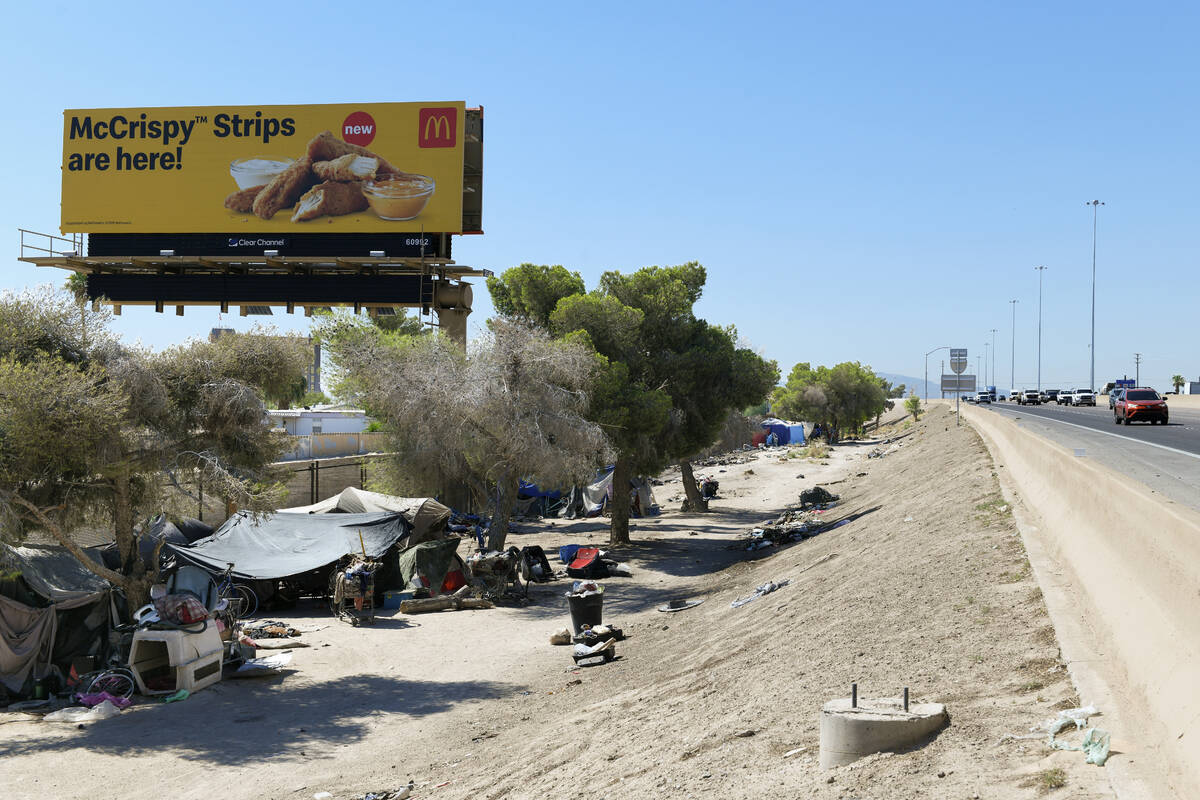Homeless encampments are seen along Interstate 11 between the Boulder Highway and Charleston Bo ...