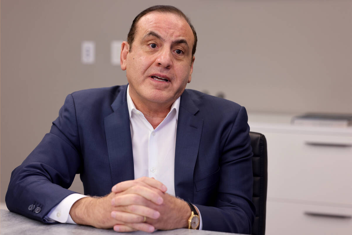 Former casino executive Gamal Aziz talks to a reporter at a Premier Workspaces in Las Vegas Wed ...