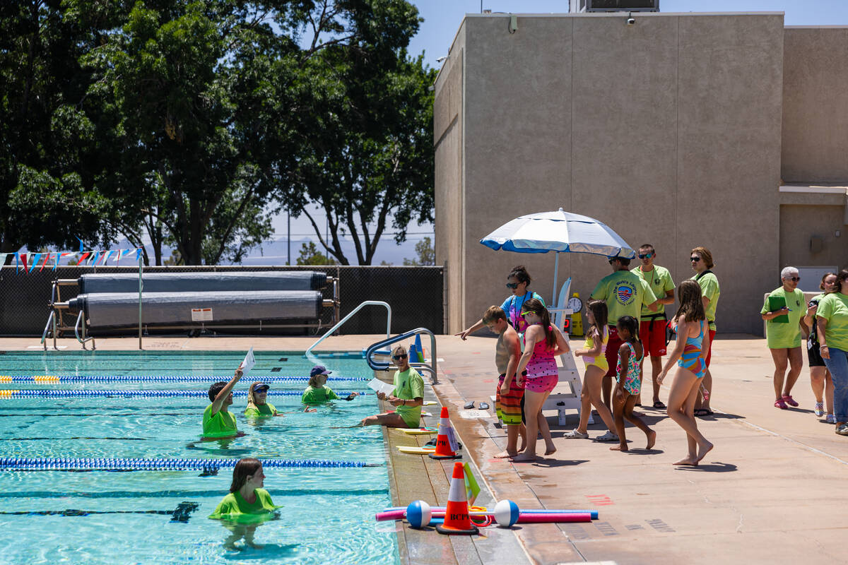 Children head to the pool for the World’s Largest Swim Lesson at the Boulder City Munici ...