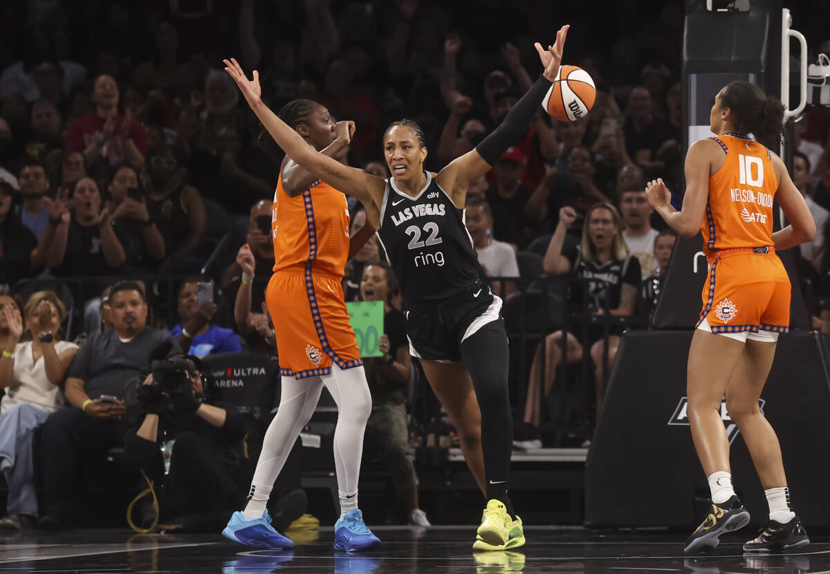 Aces center A'ja Wilson (22) reacts after reaching 5,000 career points during the first half of ...