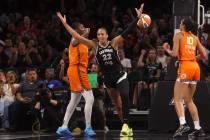 Aces center A'ja Wilson (22) reacts after reaching 5,000 career points during the first half of ...