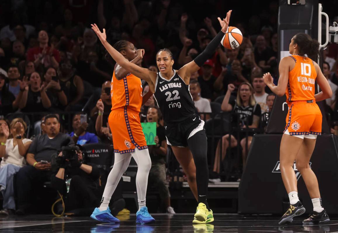Aces center A'ja Wilson (22) reacts after reaching 5,000 career points during the first half of ...