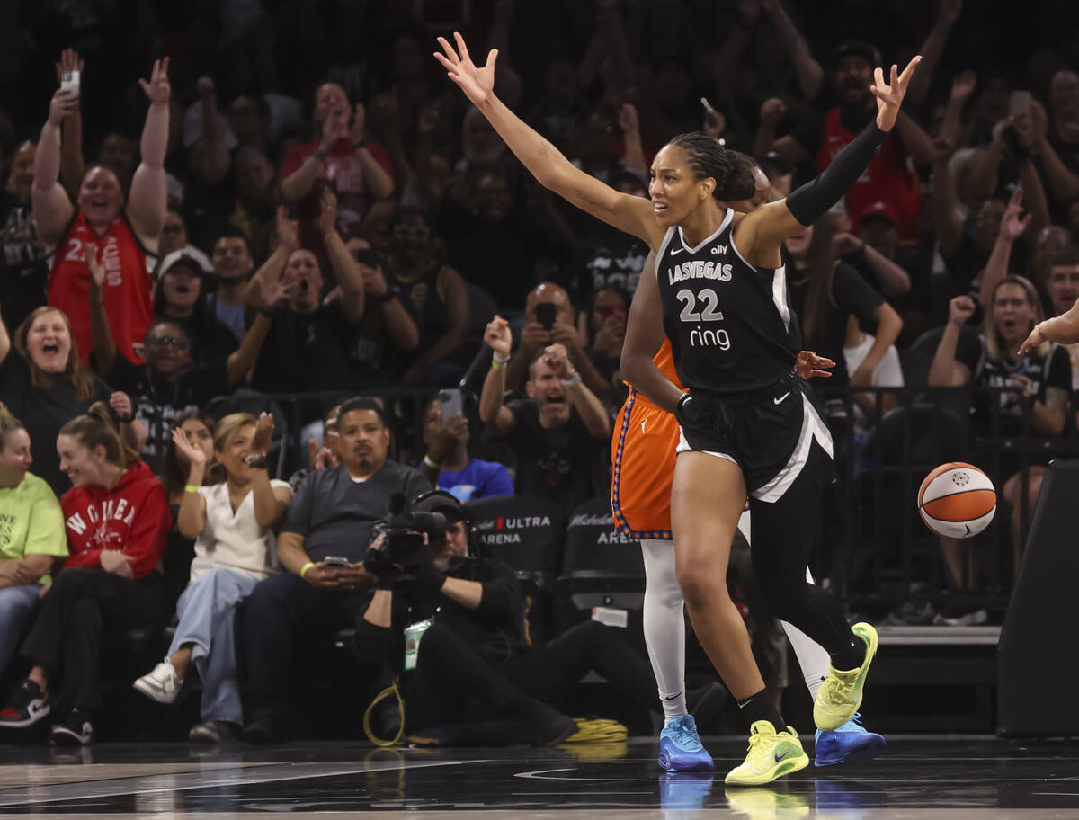 Aces center A'ja Wilson (22) reacts after reaching 5,000 career points during the first half of ...