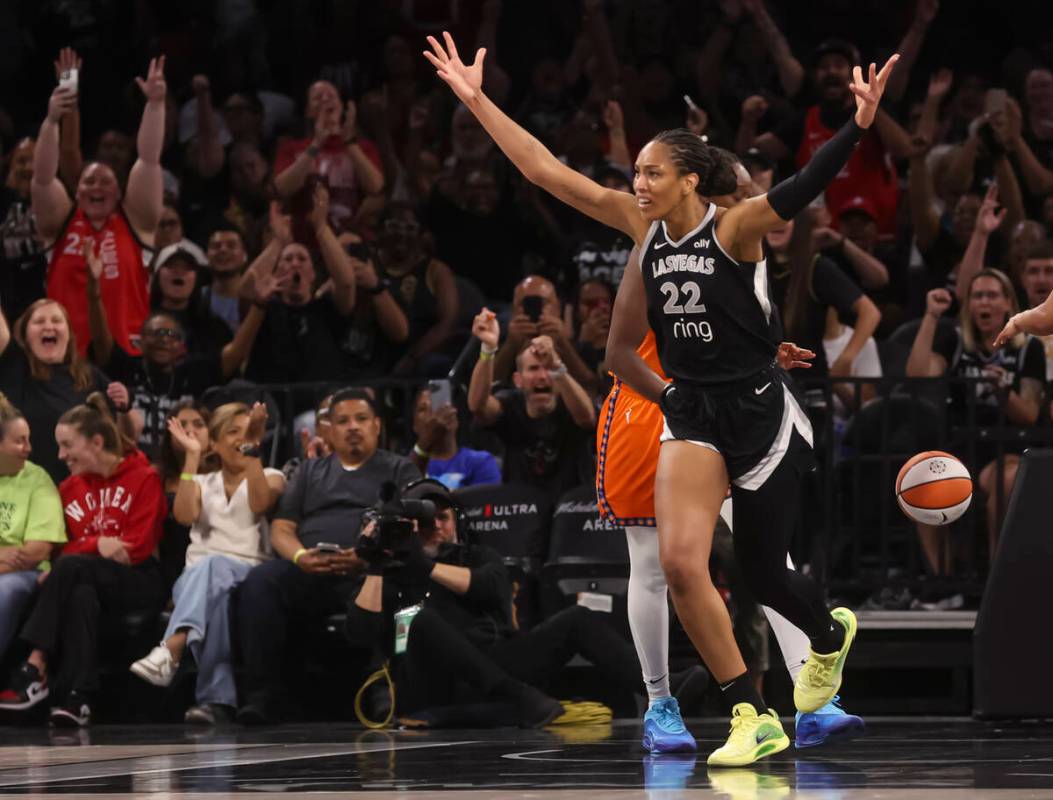Aces center A'ja Wilson (22) reacts after reaching 5,000 career points during the first half of ...