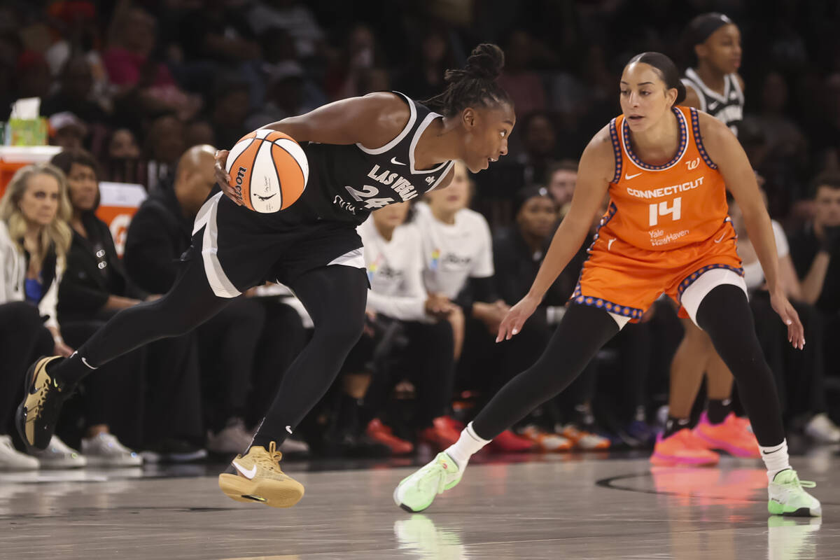 Aces guard Jewell Loyd (24) drives the ball against Connecticut Sun guard Bria Hartley (14) dur ...