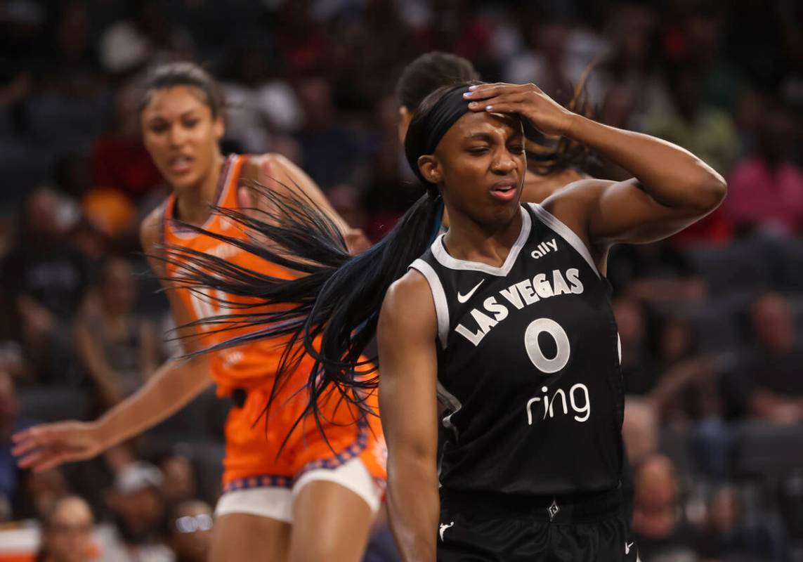 Aces guard Jackie Young (0) reacts after getting fouled by Connecticut Sun center Olivia Nelson ...