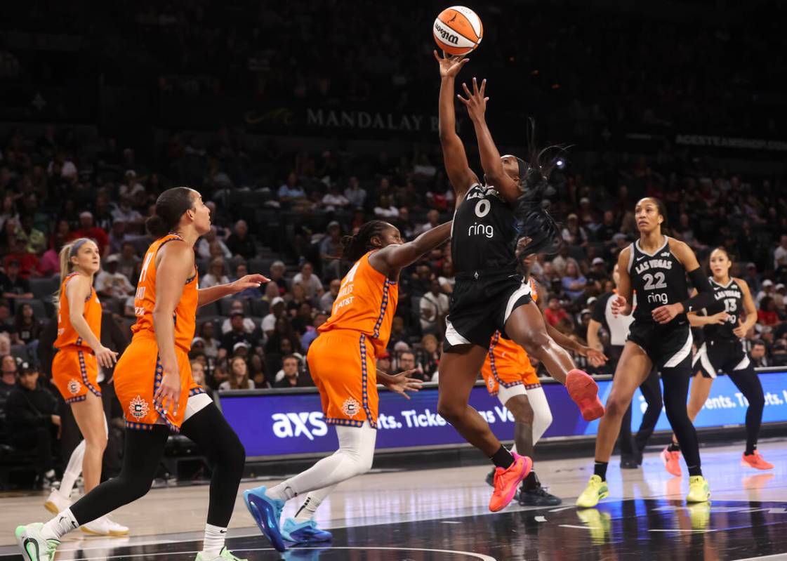 Aces guard Jackie Young (0) lays up the ball against the Connecticut Sun during the second half ...