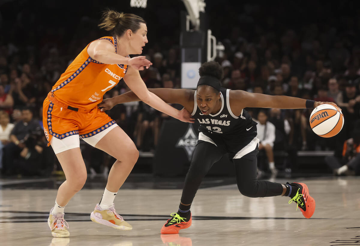 Aces guard Chelsea Gray (12) brings the ball up court against Connecticut Sun forward Haley Pet ...