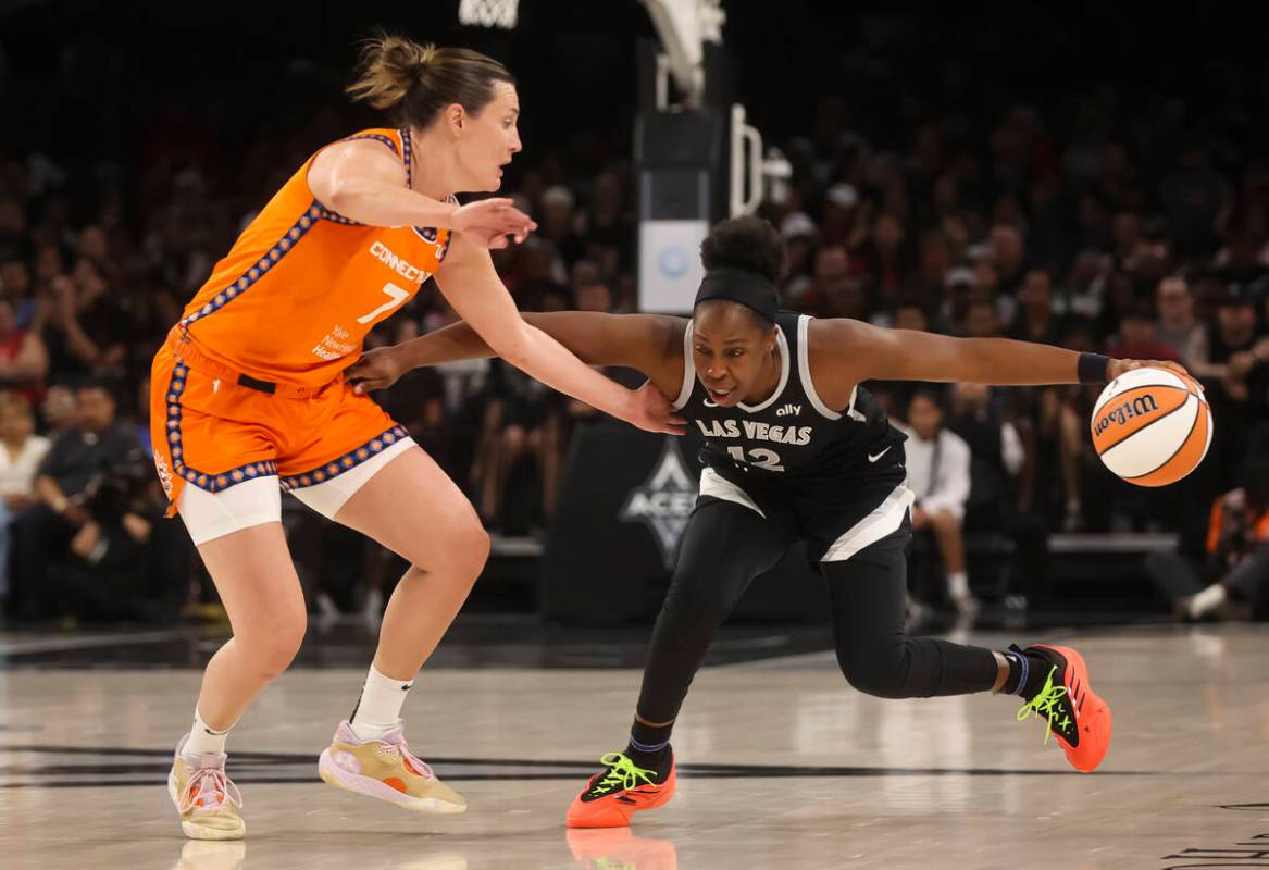 Aces guard Chelsea Gray (12) brings the ball up court against Connecticut Sun forward Haley Pet ...