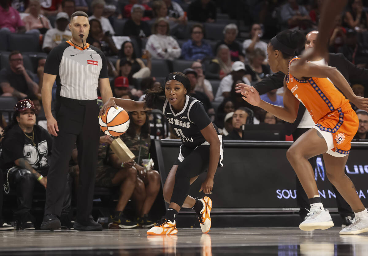 Aces guard Dana Evans (11) brings the ball up court against the Connecticut Sun during the seco ...