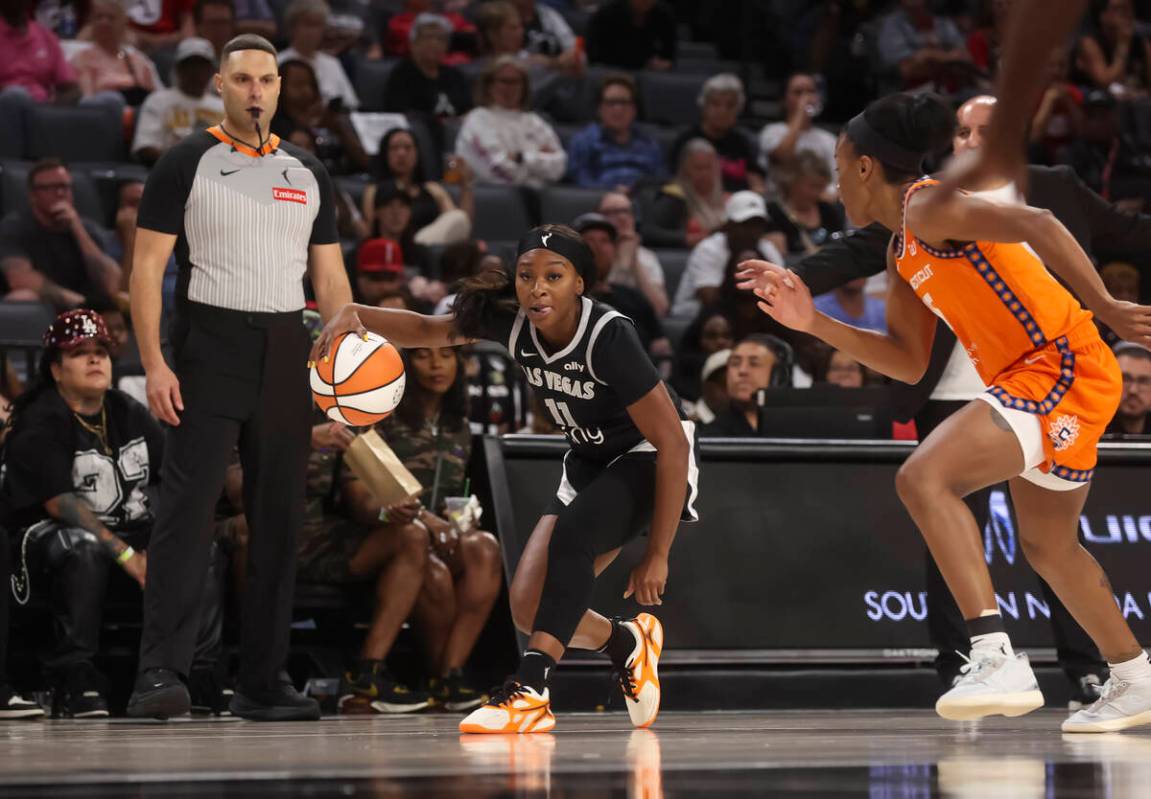 Aces guard Dana Evans (11) brings the ball up court against the Connecticut Sun during the seco ...