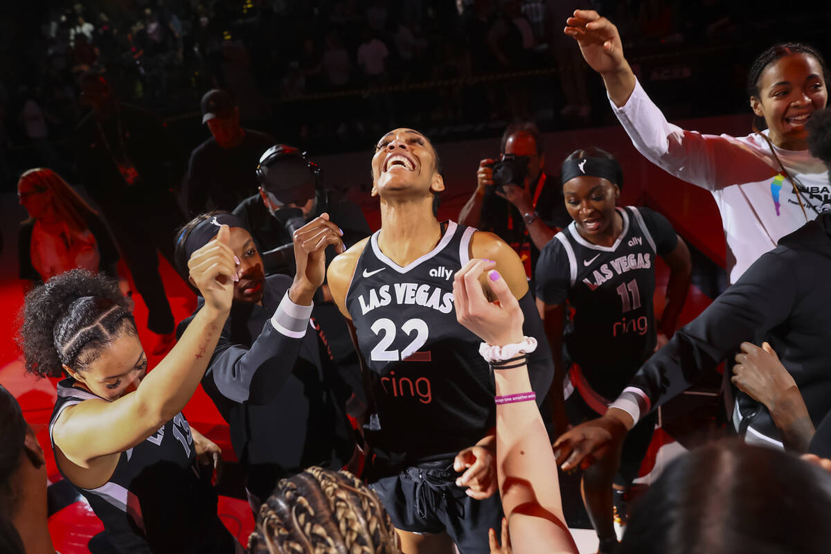 Aces center A'ja Wilson (22) celebrates with teammates after defeating the Connecticut Sun in a ...