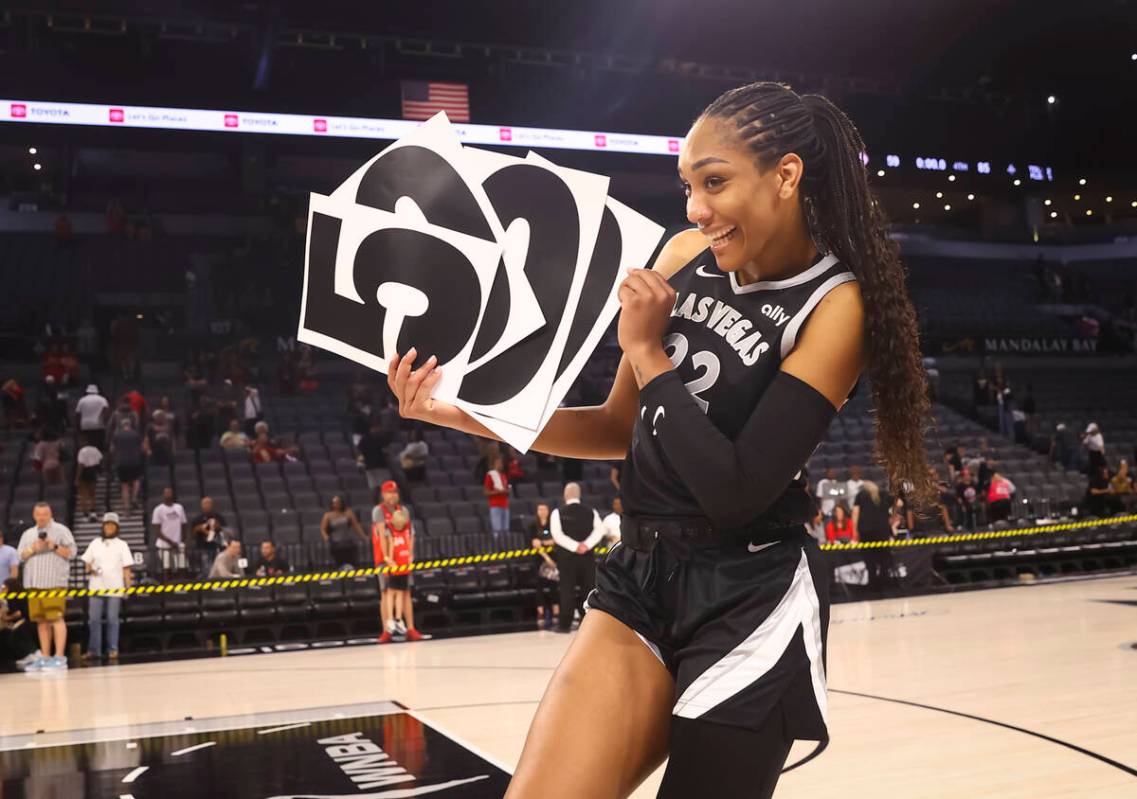 Aces center A'ja Wilson (22) celebrates her 5,000 career points after defeating the Connecticut ...
