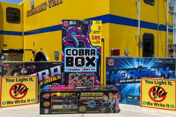 A set of fireworks sits on a fold-out table in front of a Clark County Fire Department Command ...
