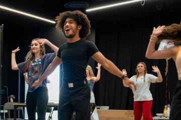 Chris Hayes Jr., middle, rehearses for the upcoming production of “Mean Girls” alongside co ...