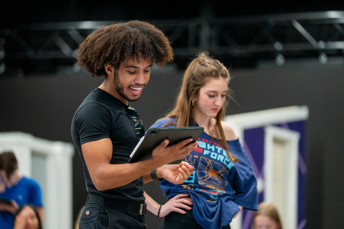 Chris Hayes Jr., left, rehearses for the upcoming production of “Mean Girls” alongside co- ...