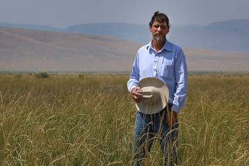 Longtime Nevada rancher Edward Bartell poses for a portrait while standing in some Great Basin ...