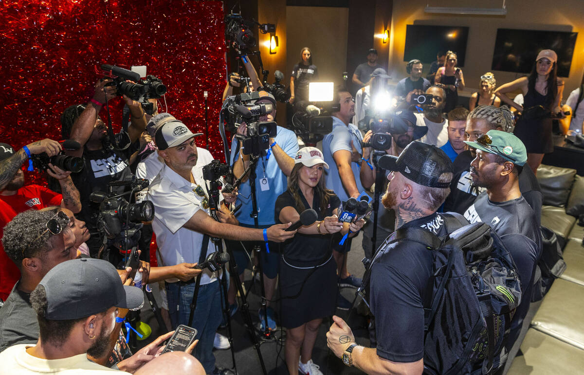 NFL defensive players Cam Jordan, Von Miller and Maxx Crosby talk with members of the media dur ...