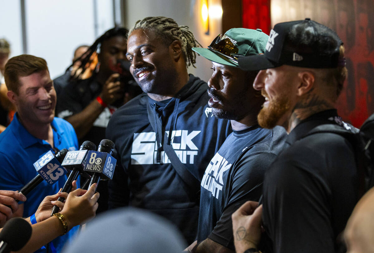 NFL defensive players Cam Jordan, Von Miller and Maxx Crosby enjoy a talk with members of the m ...