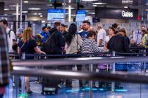 Travelers wind their way through the TSA security checkpoint in Terminal One at Harry Reid Inte ...