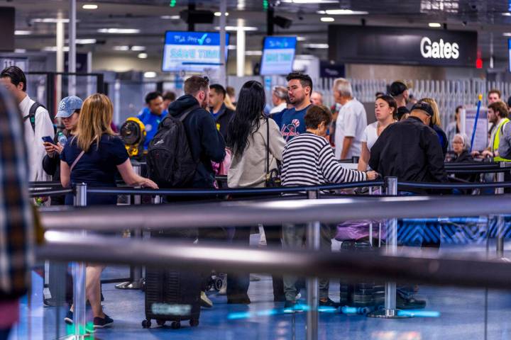 Travelers wind their way through the TSA security checkpoint in Terminal One at Harry Reid Inte ...