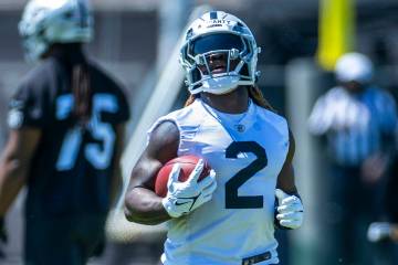 Raiders running back Ashton Jeanty (2) runs the ball up the field during Raiders OTA practice a ...