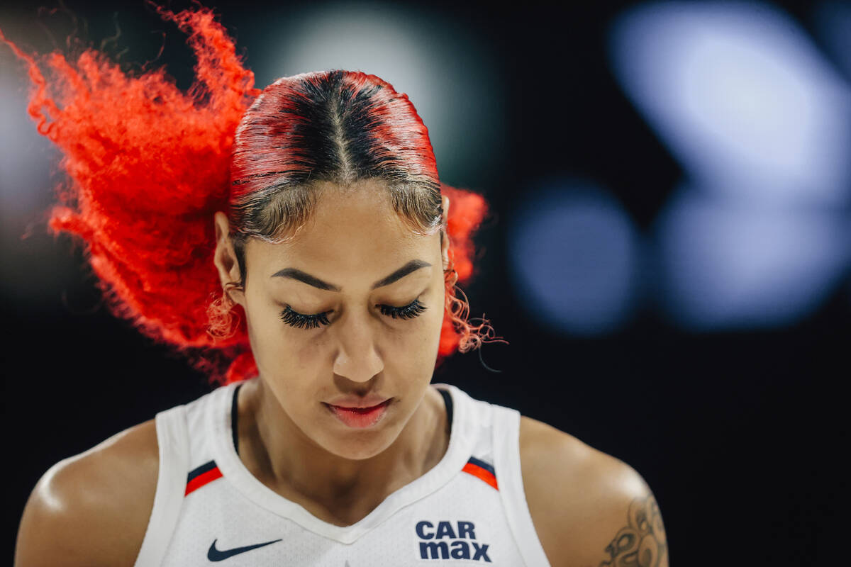 Washington Mystics forward Shakira Austin walks back down the court during a WNBA game between ...