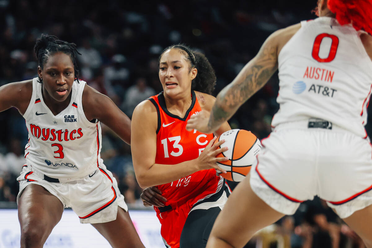 Aces guard Aaliyah Nye (13) tries to drive the ball during a WNBA game between the Aces and Was ...