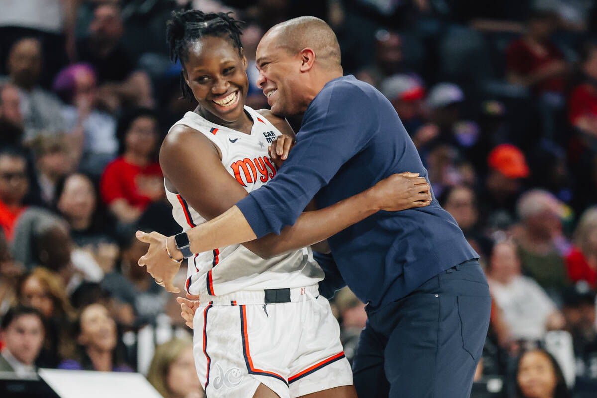 Washington Mystics forward Sika Kone (3) gets a hug from head coach Sydney Johnson during a tim ...