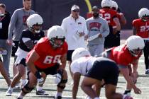 UNLV football offensive line coach Mike Sollenne, left, and head coach Dan Mullen watche their ...