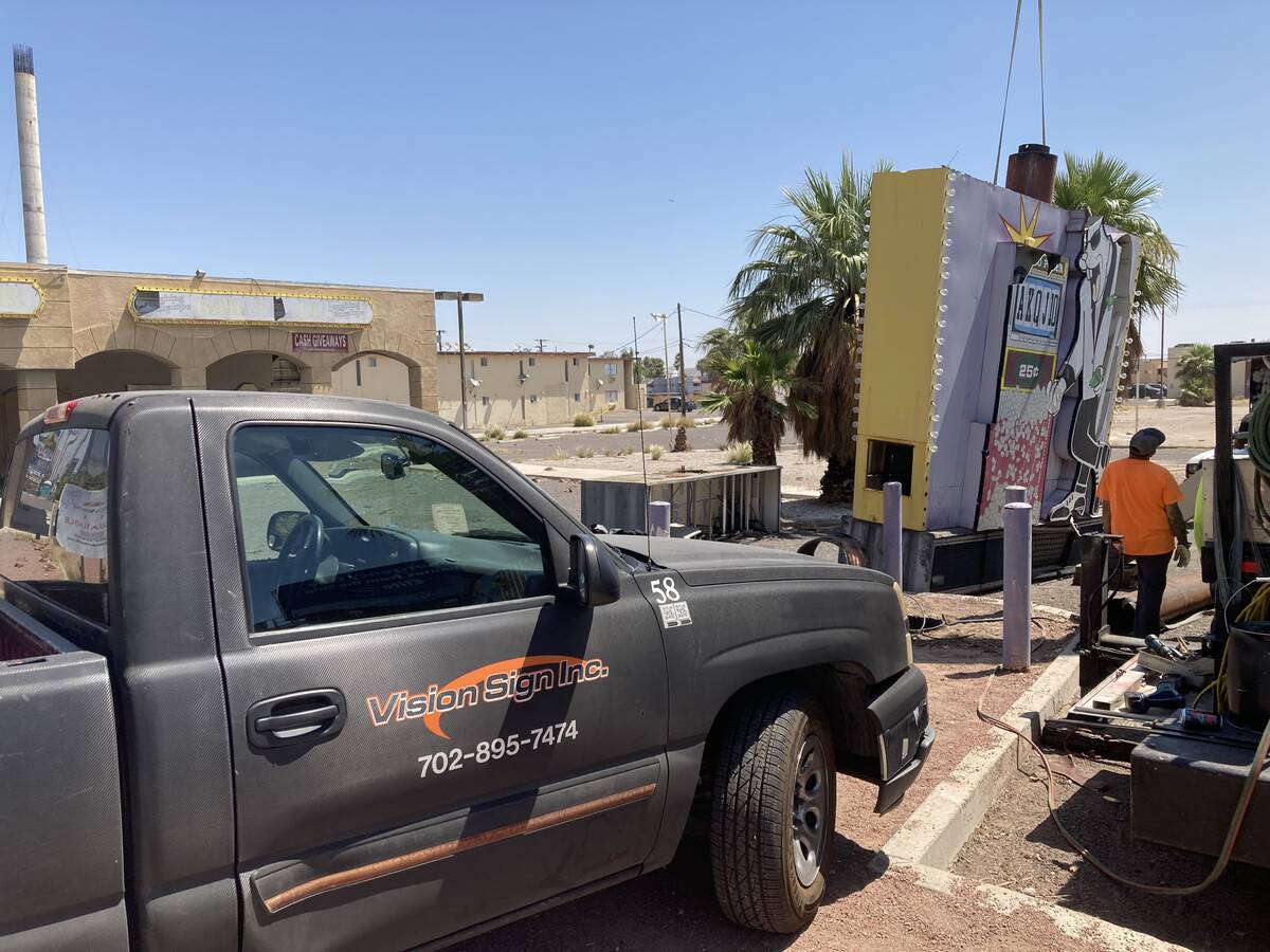 A damaged sign at the long-shuttered Laughing Jackalope tavern on the Las Vegas Strip was being ...