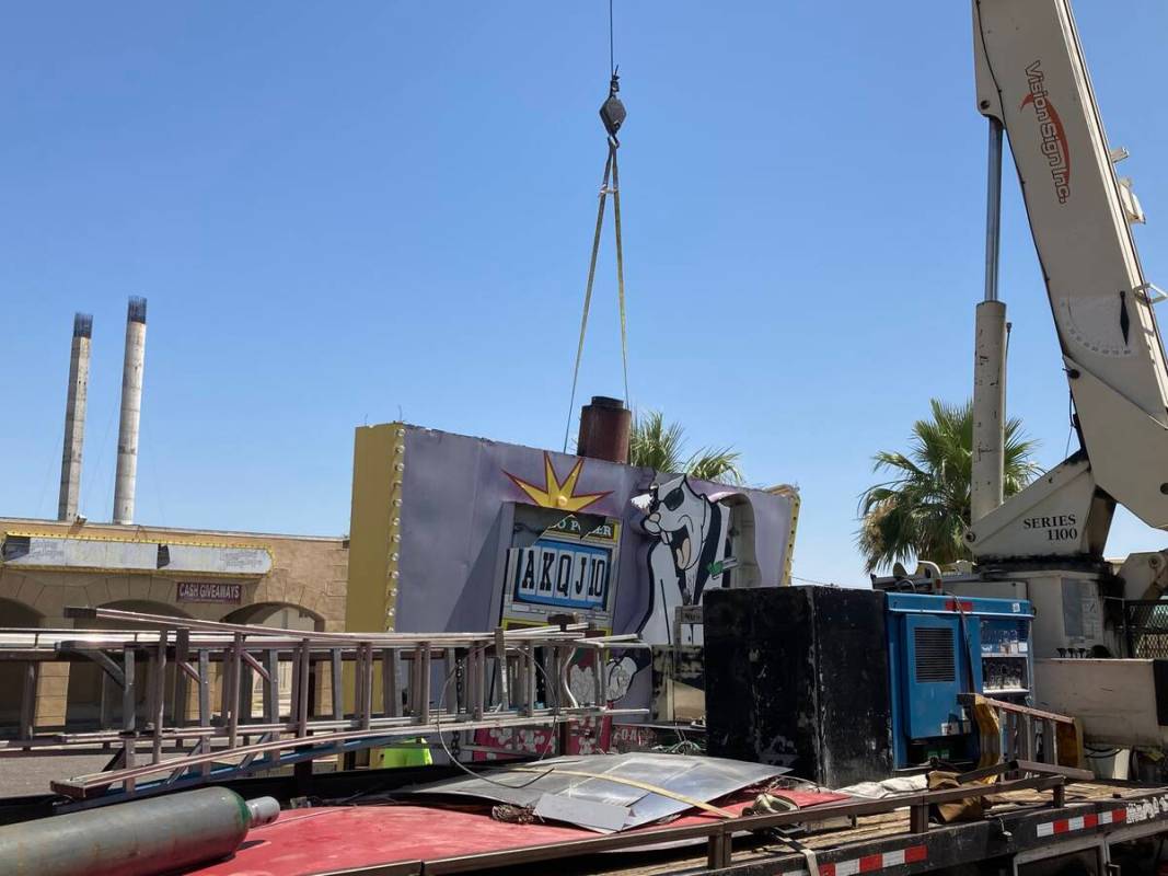 A damaged sign at the long-shuttered Laughing Jackalope tavern on the Las Vegas Strip was being ...
