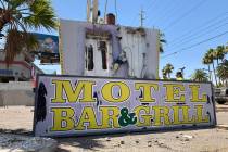 A damaged sign at the long-shuttered Laughing Jackalope tavern on the Las Vegas Strip was being ...