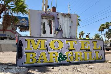 A damaged sign at the long-shuttered Laughing Jackalope tavern on the Las Vegas Strip was being ...