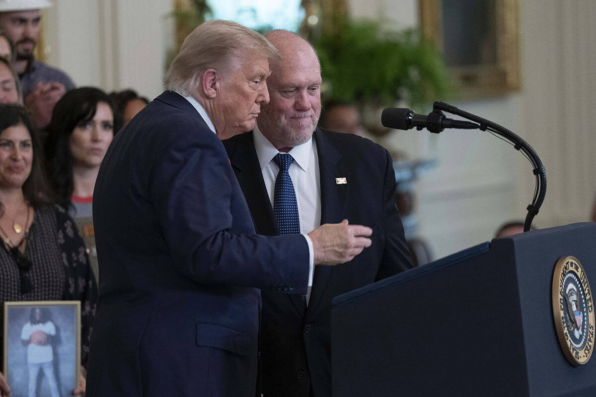 President Donald Trump talks with White House border czar Tom Homan at an event to promote Trum ...