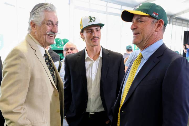 Baseball great Rollie Fingers, left, and his son Sam Fingers visit with A’s owner John Fisher ...