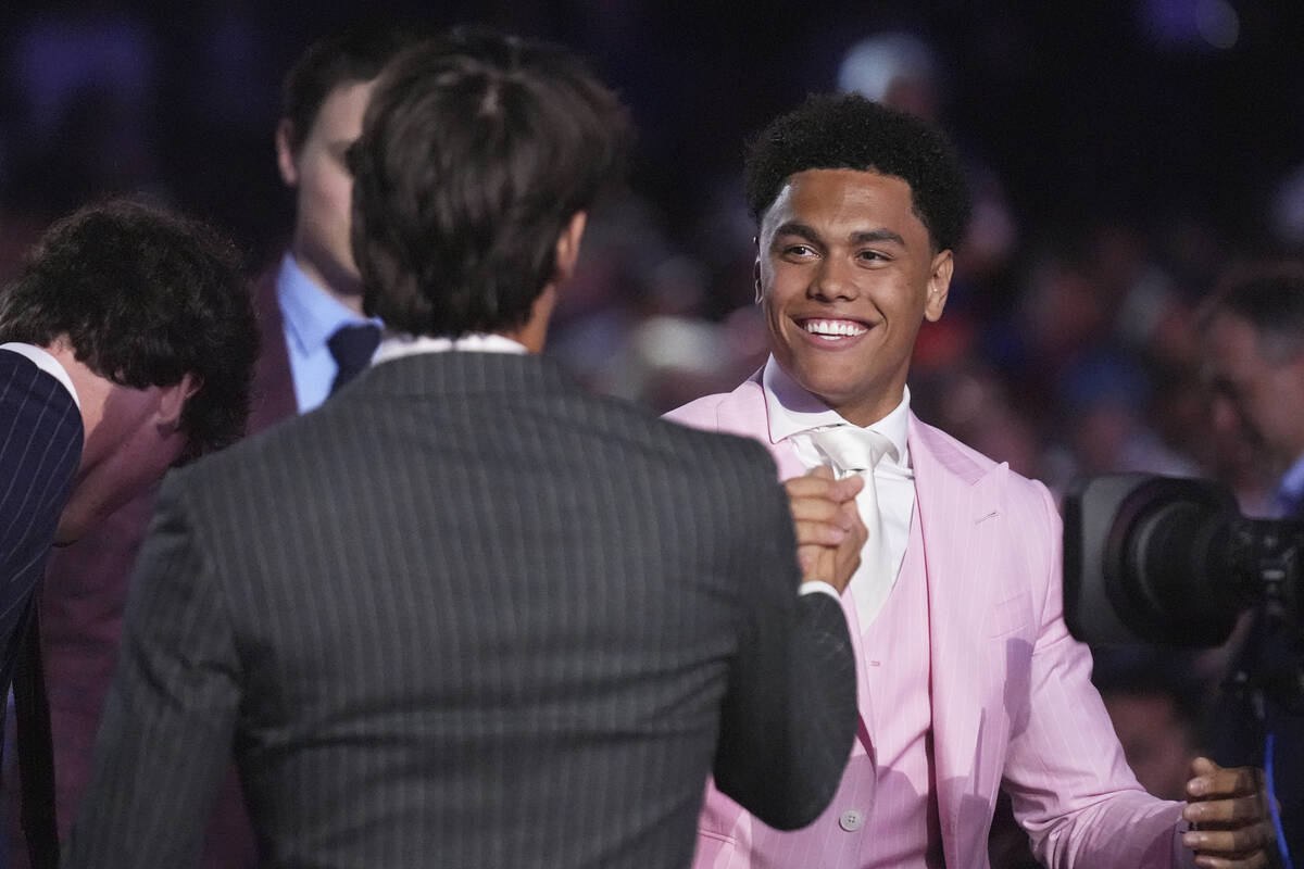 Kashawn Aitcheson, right, is congratulated after being drafted by the New York Islanders during ...