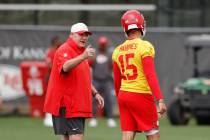 Kansas City Chiefs head coach Andy Reid, left, talks with quarterback Patrick Mahomes (15) duri ...
