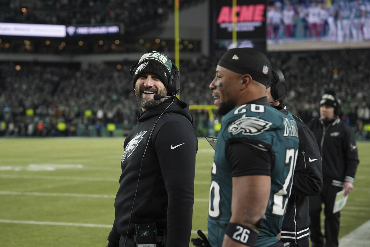 Philadelphia Eagles' Nick Sirianni and Saquon Barkley react during the NFC Championship NFL foo ...