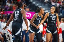 Aces guard Aaliyah Nye (13) is celebrated by her teammates Aces guard Tiffany Mitchell (3) and ...