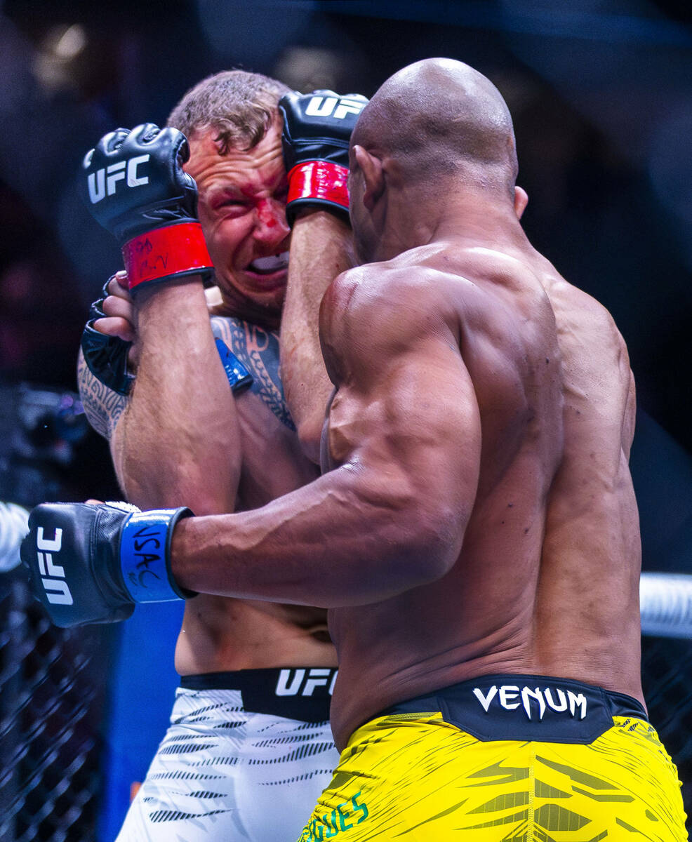 Jack Hermansson covers up from Gregory Rodrigues during their middleweight fight in UFC 317 at ...