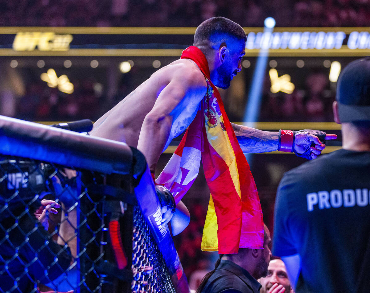 Ilia Topuria celebrates his win over Charles Oliveira with his team during their lightweight ti ...