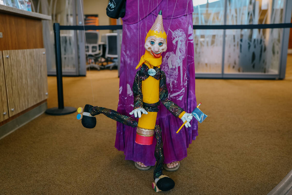 Buddy the marionette ventures out to greet families attending Discovery Day on Saturday, June 2 ...