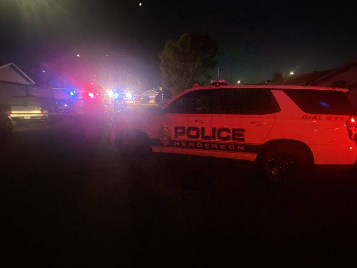 A Henderson police vehicle was stationed outside the scene of a fire in the 600 block of Winche ...