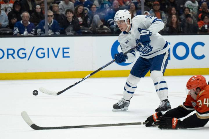FILE - Toronto Maple Leafs right wing Mitch Marner (16) shoots past Anaheim Ducks defenseman Pa ...
