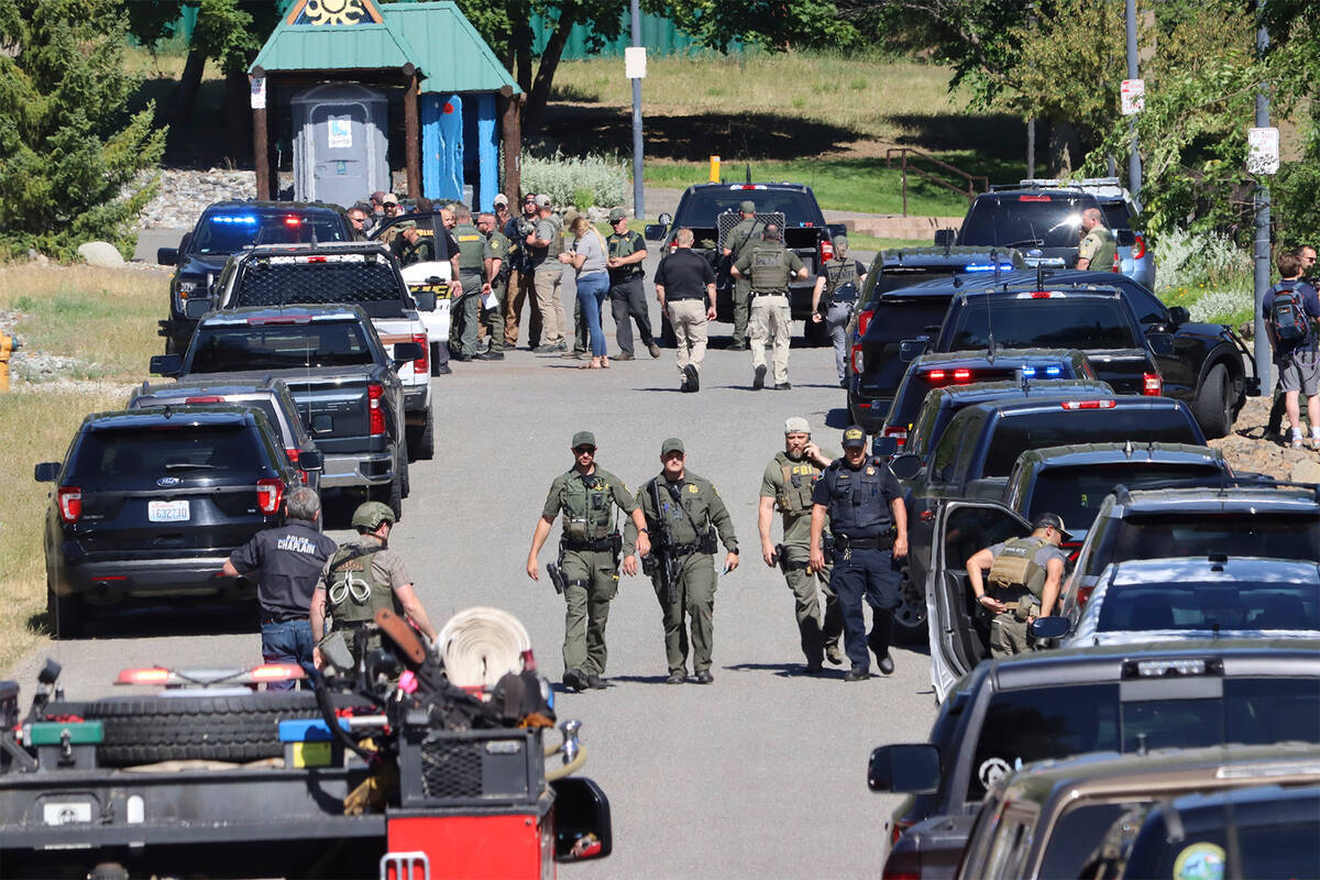 Law enforcement and emergency responders at Cherry Hill Park off 15th Street on Sunday afternoo ...