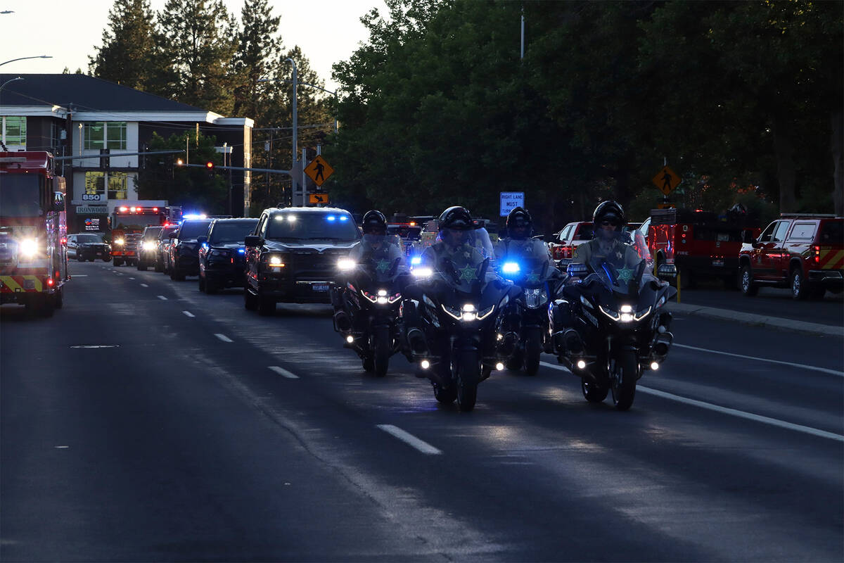 A procession from Kootenai Health headed to Spokane after a few firefighters were killed Sunday ...