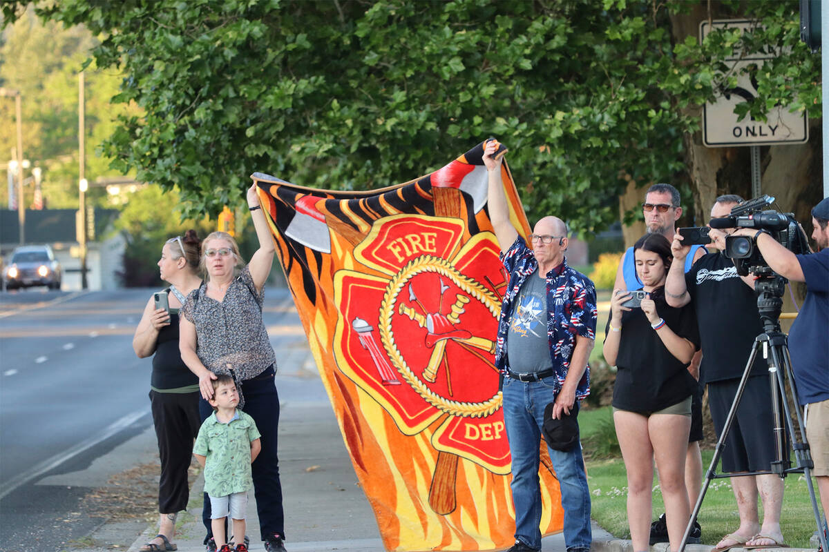 A procession from Kootenai Health headed to Spokane after a few firefighters were killed Sunday ...