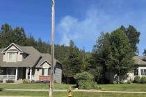 In this photo provided by Mark Lathrop, a blaze burns in a community near Canfield Mountain whe ...